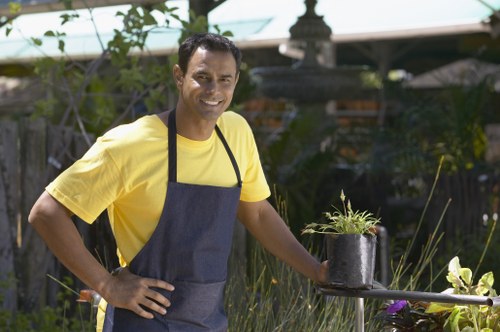 Low-maintenance landscape gardening features in a Fortis Green home garden