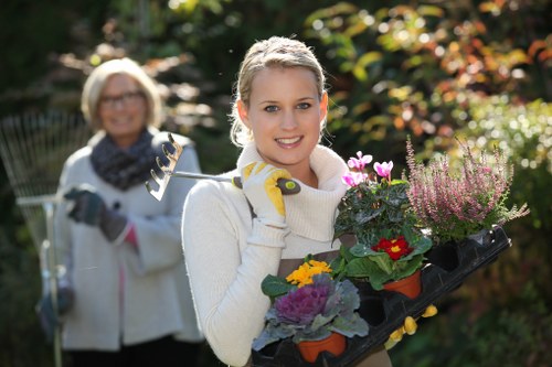 Local gardener maintaining borders and lawn in Fortis Green